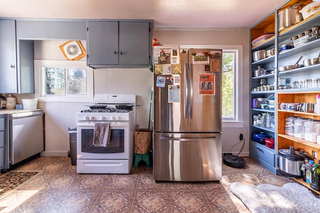 kitchen featuring gray cabinetry and stainless steel appliances