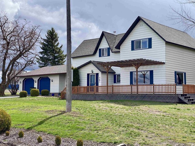 view of front facade featuring a wooden deck, a pergola, and a front yard