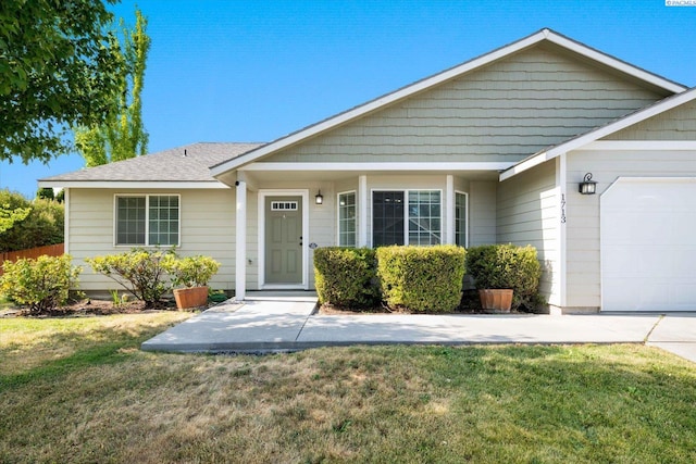 1713 W 39th Ave, Kennewick, WA 99337 - view of front of property with a garage and a front yard