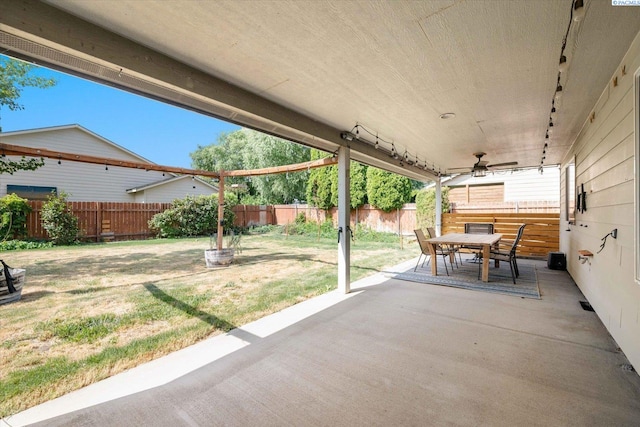 1713 W 39th Ave, Kennewick, WA 99337 - fenced backyard featuring outdoor dining area, a patio, and a ceiling fan