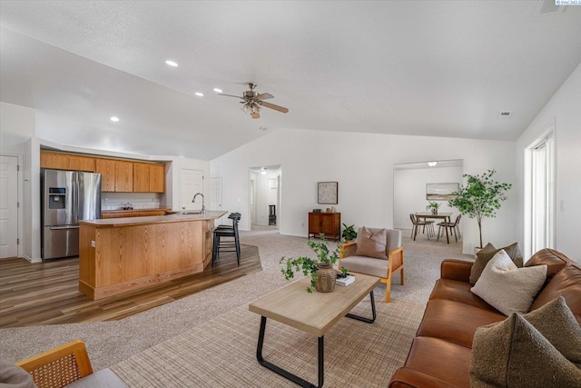 1713 W 39th Ave, Kennewick, WA 99337 - living room with lofted ceiling, ceiling fan, light carpet, and recessed lighting