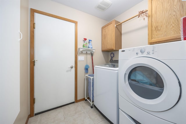 2532 W 32nd Ave, Kennewick, WA 99337 - laundry room with cabinet space, separate washer and dryer, and light tile patterned floors