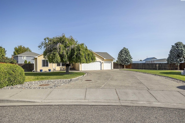 2532 W 32nd Ave, Kennewick, WA 99337 - view of property hidden behind natural elements featuring driveway and a garage