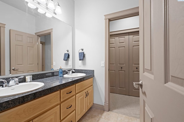 bathroom with tile patterned floors and vanity