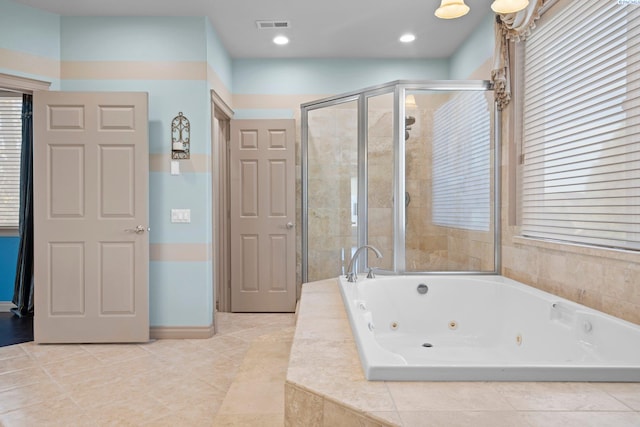 bathroom with tile patterned floors and separate shower and tub