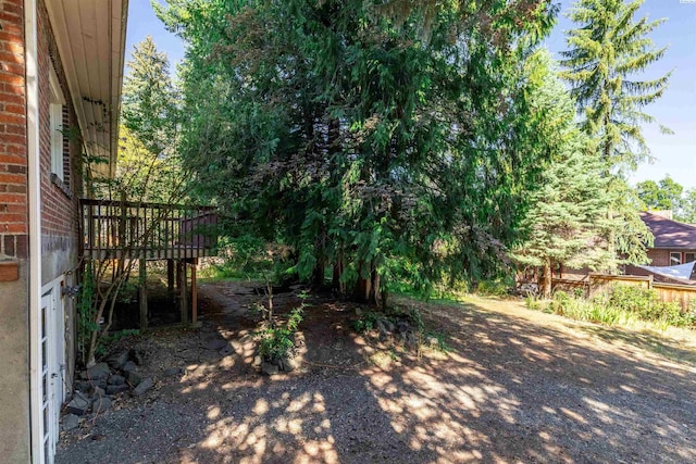 view of yard featuring a wooden deck