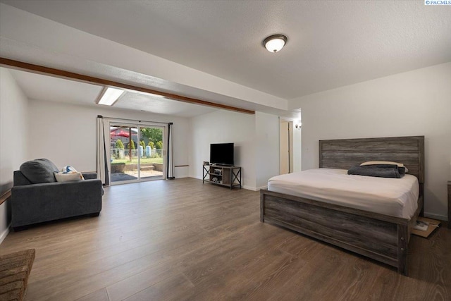 2132 Cascade Ave, Richland, WA 99354 - bedroom featuring access to outside, wood finished floors, and beamed ceiling
