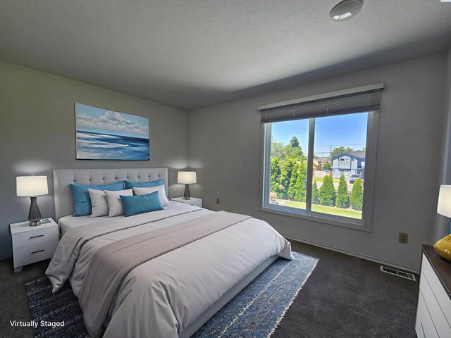 5307 W Irving St, Pasco, WA 99301 - bedroom featuring dark colored carpet and baseboards
