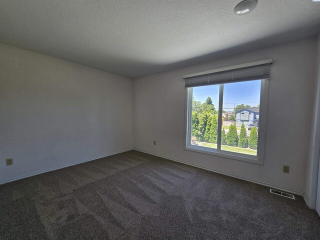 5307 W Irving St, Pasco, WA 99301 - carpeted spare room featuring a textured ceiling and baseboards