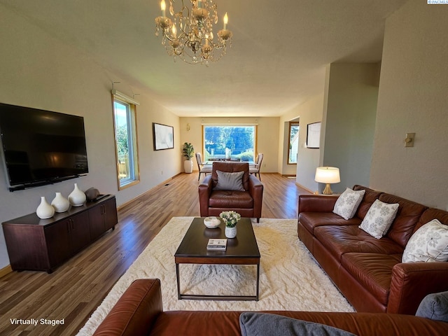 5307 W Irving St, Pasco, WA 99301 - living room with a chandelier, healthy amount of natural light, wood finished floors, and baseboards