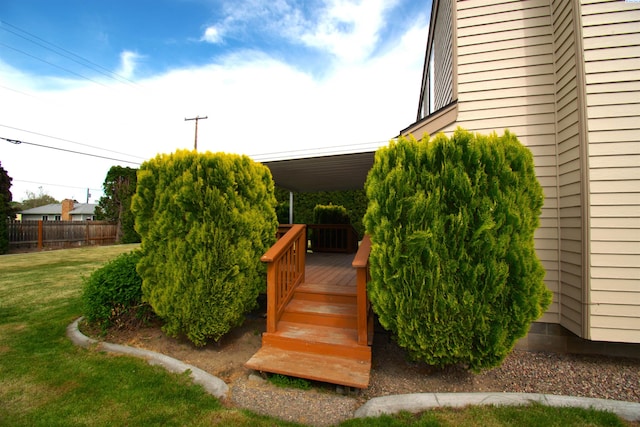 view of yard with fence and a deck