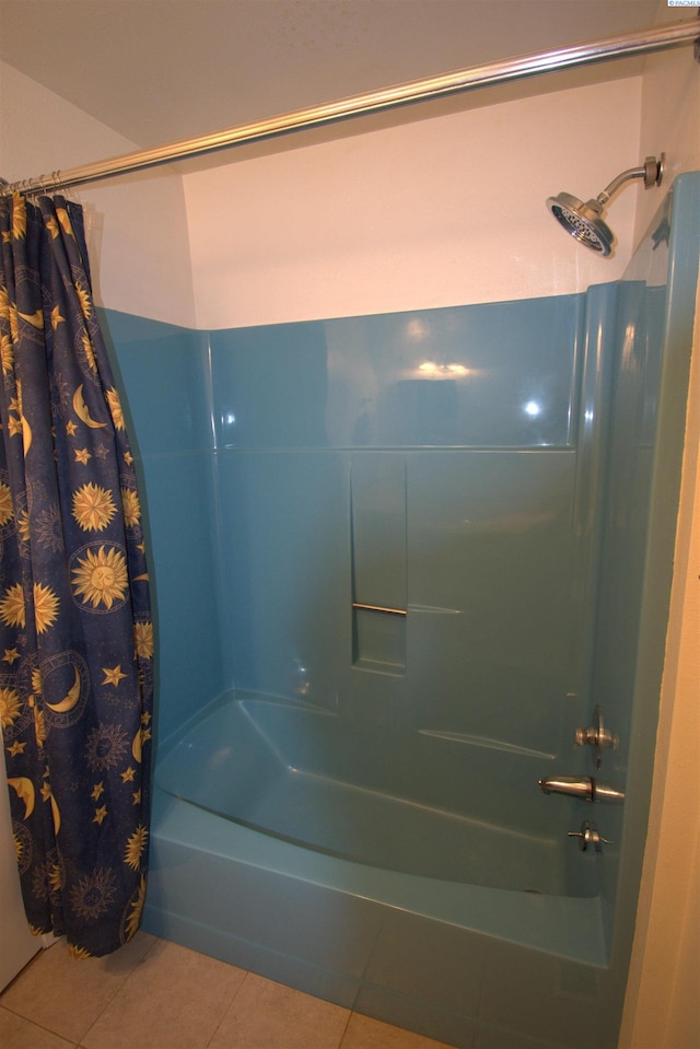 bathroom featuring tile patterned flooring and shower / tub combo