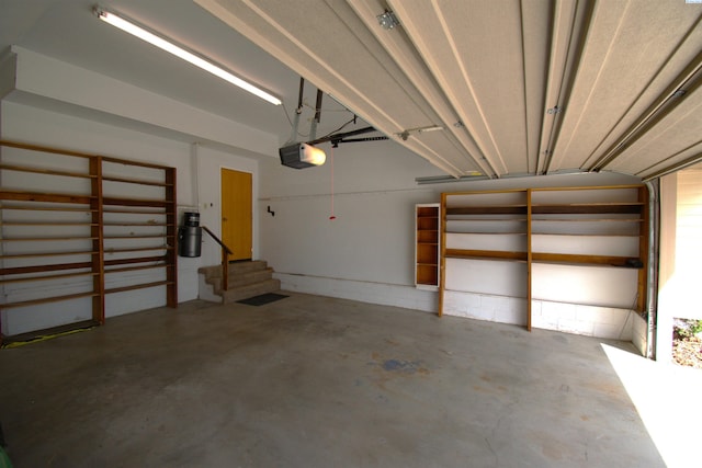 garage featuring a garage door opener