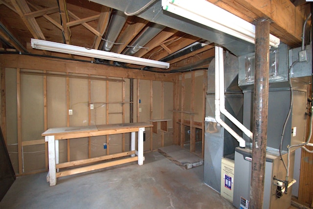 unfinished below grade area featuring heating unit