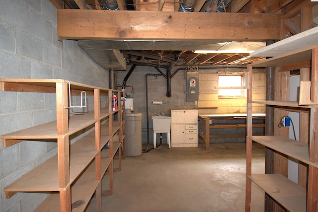 below grade area with a workshop area, a sink, and electric panel