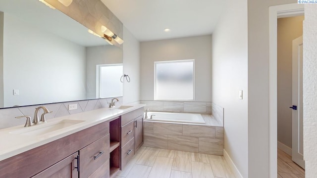 4801 White Dr, Richland, WA 99352 - bathroom with vanity and tiled tub