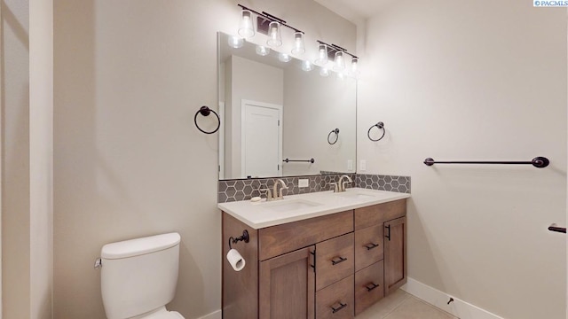 4801 White Dr, Richland, WA 99352 - bathroom featuring tasteful backsplash, vanity, tile patterned flooring, and toilet