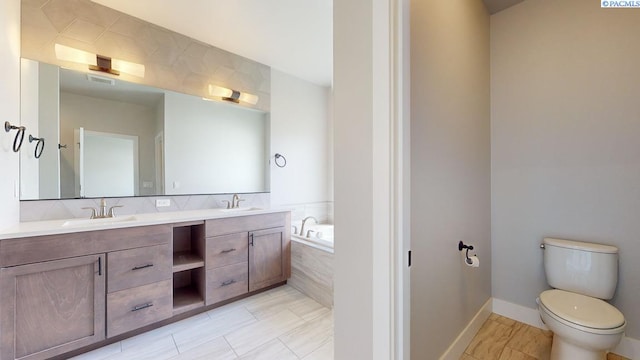 4801 White Dr, Richland, WA 99352 - bathroom with a relaxing tiled tub, vanity, and toilet