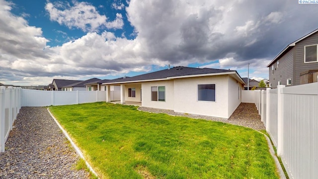 4801 White Dr, Richland, WA 99352 - rear view of property featuring a lawn