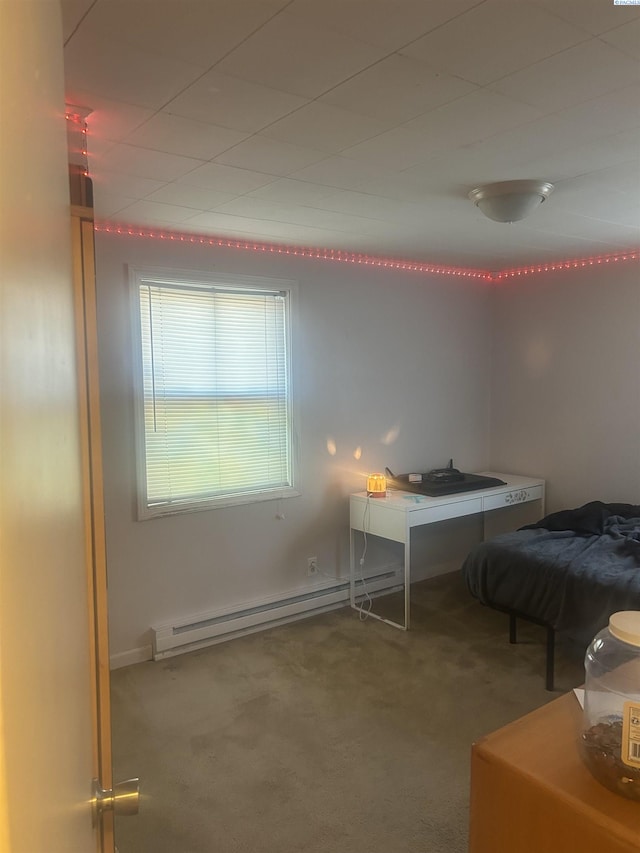 carpeted bedroom with a baseboard radiator