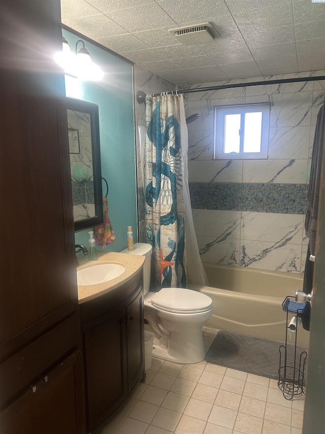 full bath featuring toilet, shower / bath combo, visible vents, and vanity