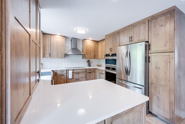 495 NW Robert St, Pullman, WA 99163 - kitchen with wall chimney exhaust hood, appliances with stainless steel finishes, and light brown cabinetry