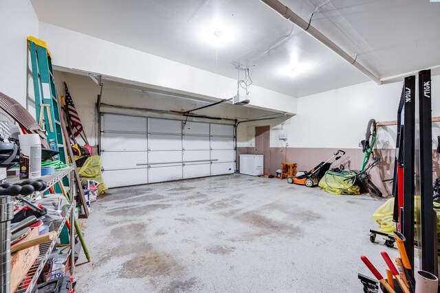 495 NW Robert St, Pullman, WA 99163 - garage with a garage door opener and fridge