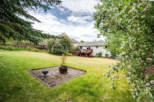 495 NW Robert St, Pullman, WA 99163 - view of yard with a fire pit and a deck