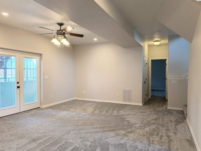 empty room featuring french doors, carpet flooring, visible vents, and baseboards