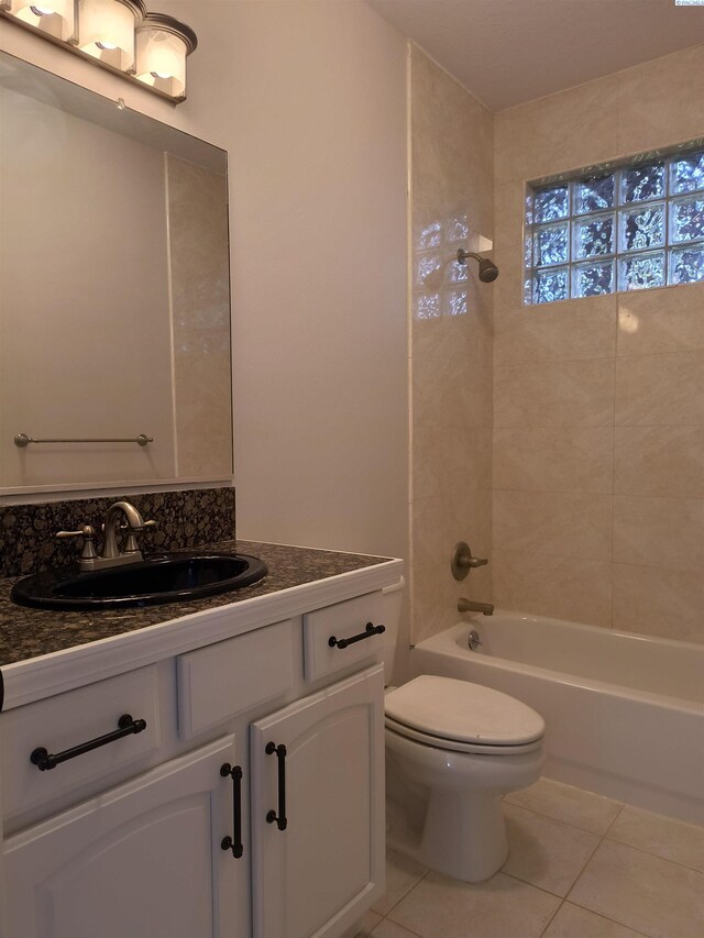 bathroom with shower / bathtub combination, vanity, toilet, and tile patterned floors