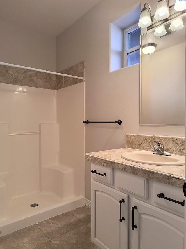 bathroom featuring vanity and walk in shower