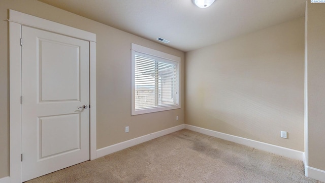 view of carpeted spare room