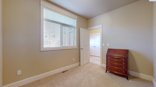 bedroom with light colored carpet