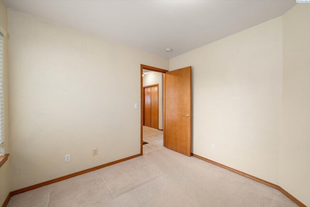 carpeted living room featuring vaulted ceiling