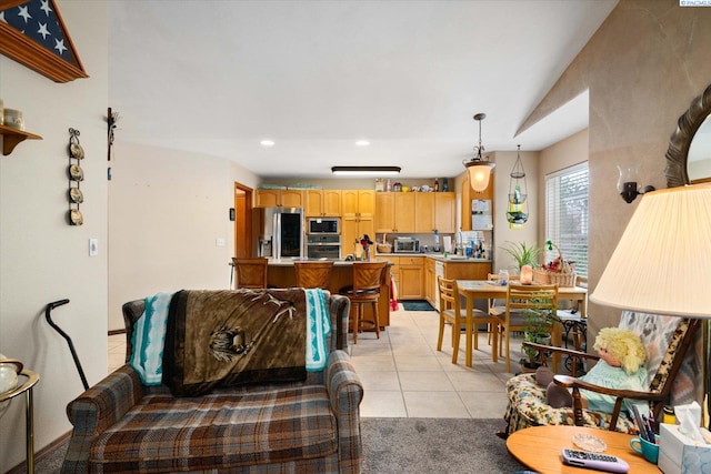 living area featuring recessed lighting and light tile patterned floors