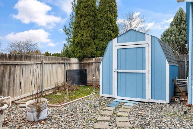 view of shed featuring a fenced backyard