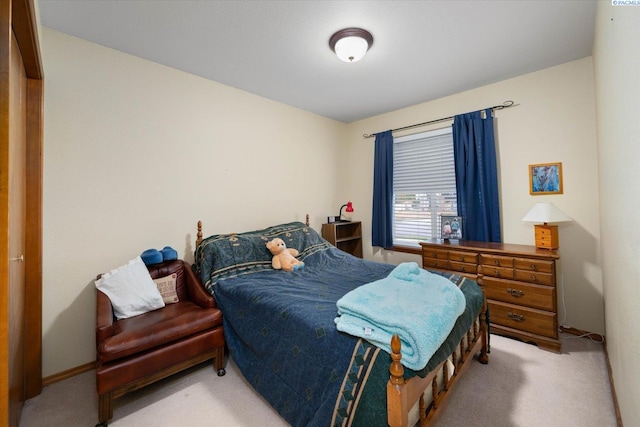 bedroom featuring light colored carpet