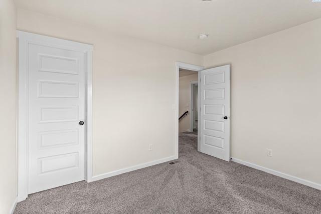 4006 Phoenix Ln, Pasco, WA 99301 - unfurnished bedroom with baseboards, visible vents, and carpet floors