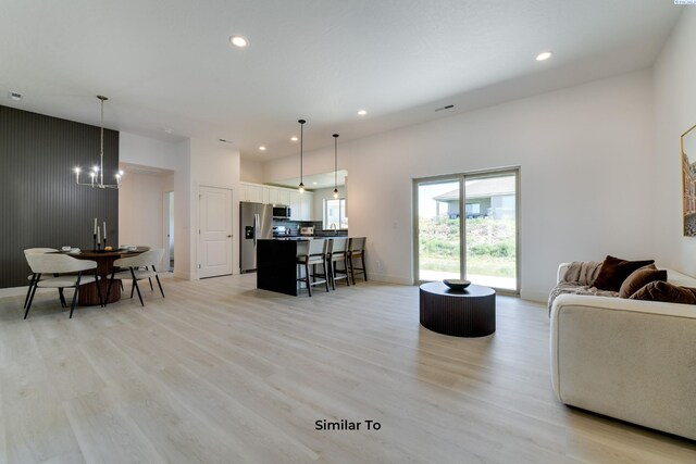 1608 Diamond Ave, Grandview, WA 98930 - living room with light wood-style floors, recessed lighting, a chandelier, and baseboards