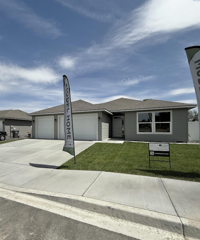 2625 S Beech St, Kennewick, WA 99337 - ranch-style home featuring concrete driveway, an attached garage, and a front lawn