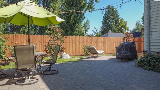 420 SE Dexter St, Pullman, WA 99163 - view of patio featuring a fire pit, grilling area, and fence