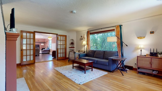 420 SE Dexter St, Pullman, WA 99163 - living area featuring plenty of natural light, french doors, light wood-type flooring, and baseboards
