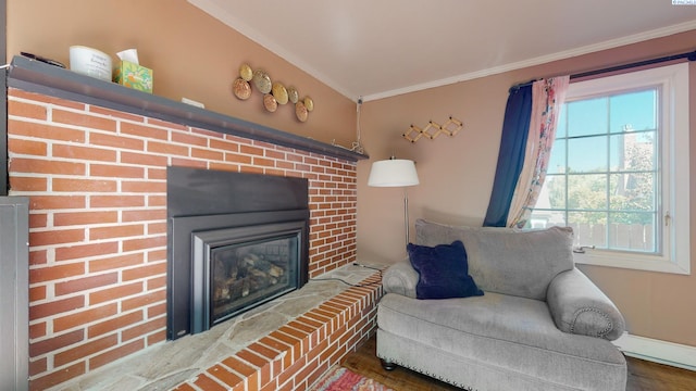 420 SE Dexter St, Pullman, WA 99163 - living area featuring crown molding, wood finished floors, baseboards, and a brick fireplace