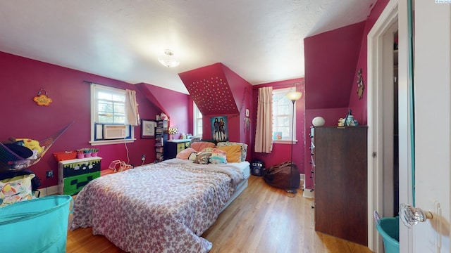 420 SE Dexter St, Pullman, WA 99163 - bedroom featuring cooling unit, multiple windows, and wood finished floors