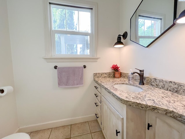 420 SE Dexter St, Pullman, WA 99163 - bathroom with tile patterned flooring, baseboards, and vanity