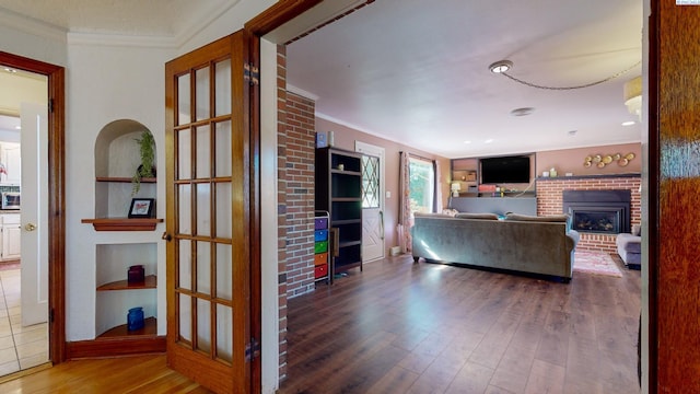 420 SE Dexter St, Pullman, WA 99163 - living room with a fireplace, ornamental molding, and wood finished floors
