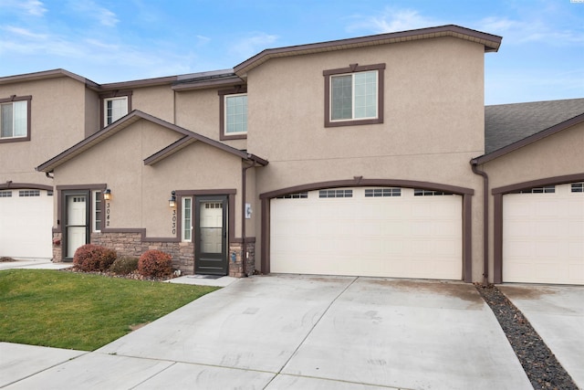 view of front property with a front lawn and a garage