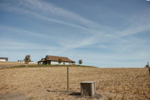 view of yard with a rural view