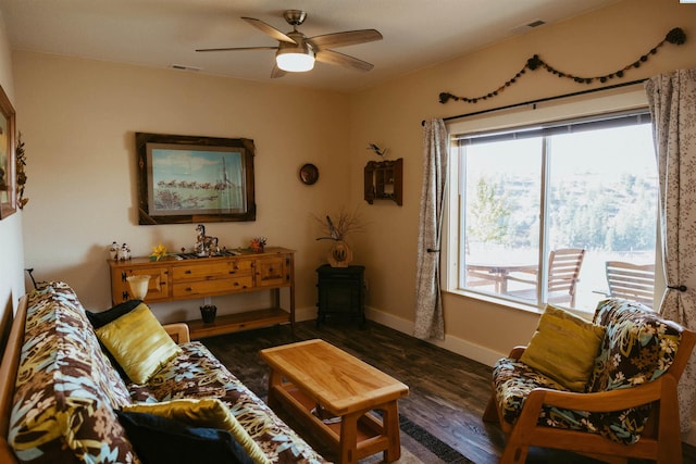 living room featuring ceiling fan, dark hardwood / wood-style floors, and a wealth of natural light