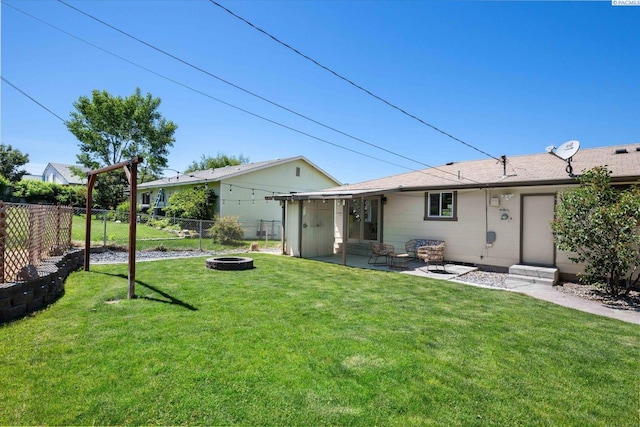 2115 W 8th Pl, Kennewick, WA 99336 - rear view of house featuring an outdoor fire pit and a patio area